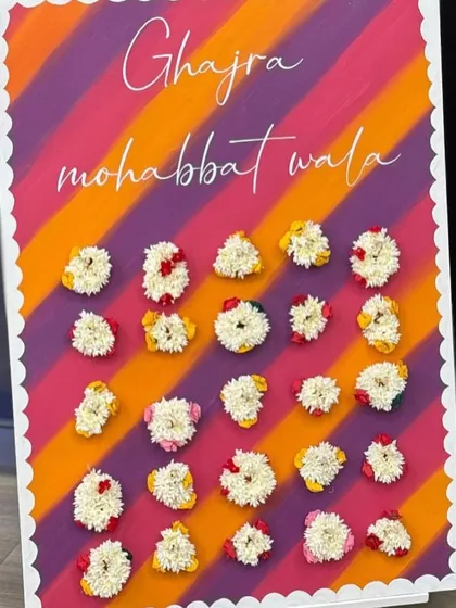 A beautiful "Ghajra mohabbat wala" board for a Sagan ceremony. Guests could pick a fresh gajra (floral bracelet) as a party favor, adding a lovely, fragrant, and traditional touch to the evening.