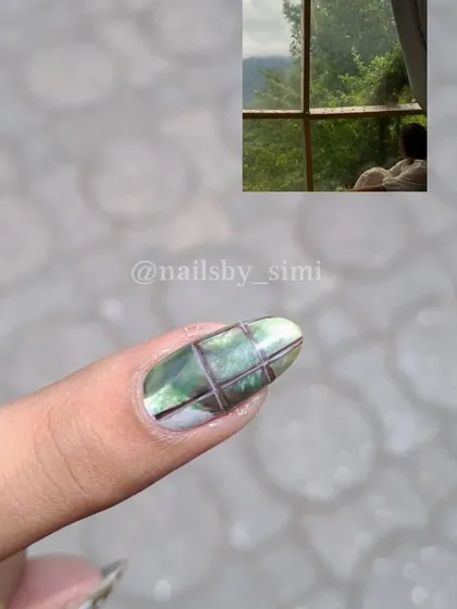 This design was inspired by the feeling of looking out a window on a rainy day. I used a watercolor technique to create the green, blurry background.