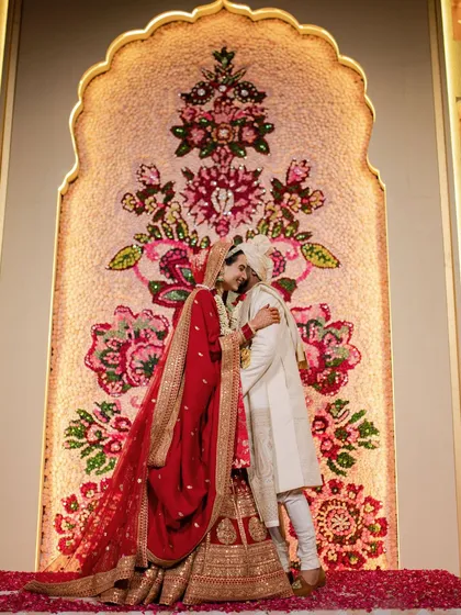 The Jaimala is the first step in a wedding, and it deserves a breathtaking backdrop. We created this intricate floral mosaic wall, handcrafting every detail to frame the couple in a piece of living art.
