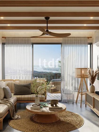 This living area is designed to bask in natural light, creating an open and inviting atmosphere. We selected minimal furniture to enhance the sense of space, while accents of greenery and natural materials like jute and wood add life and warmth to the home.
