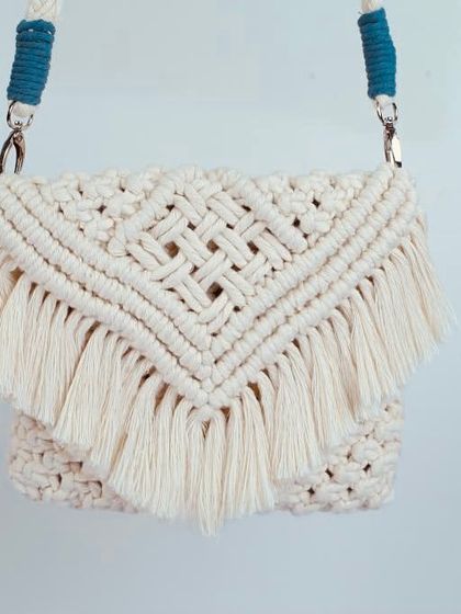 This boho sling bag has a beautiful diamond-patterned flap with long, soft fringe. I love the texture and movement it has.