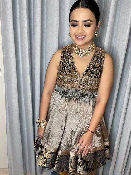 A joyful smile from a happy client. This candid shot shows how the radiant makeup look enhances her natural glow.