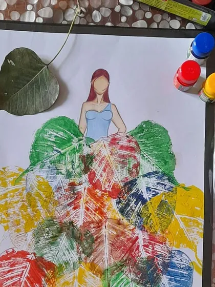 This piece from our mixed media workshop shows how students learn to combine natural elements with illustration. Here, colorful leaf prints are used to create the texture and form of a dress, blending art with fashion design.