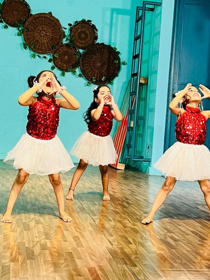 Capturing the pure, expressive joy of performance. These little ones are learning to emote and connect with their audience.