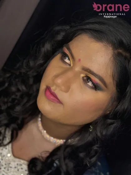 A close-up of a festive Haldi look with elegantly styled curly hair. We teach techniques to manage and style different hair textures for a flawless finish.