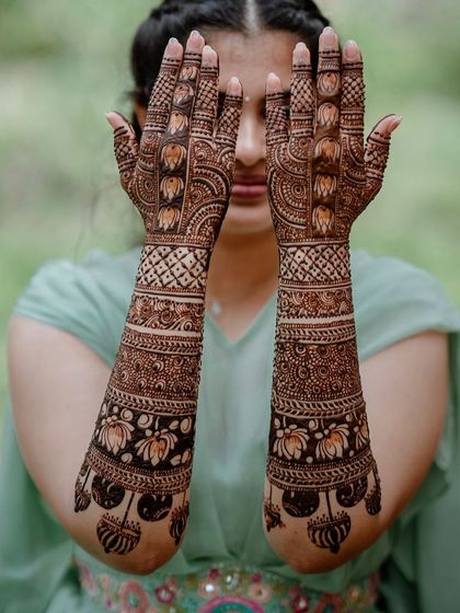 This design is filled with blooming lotus flowers and buds, creating a lush, garden-like effect on the arms. The patterns are dense and flowing.