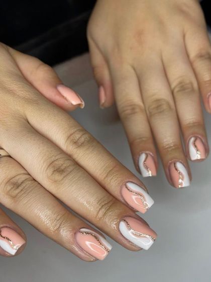 An elegant abstract design with swirls of peach, white, and rose gold glitter. The color combination is soft and sophisticated.