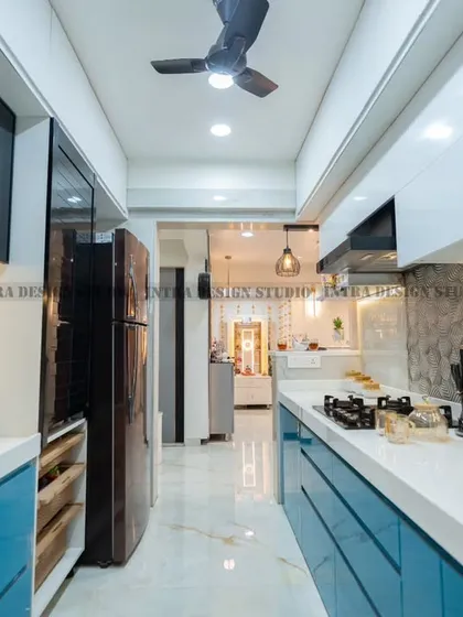 This parallel modular kitchen in Ulwe is a perfect example of how we combine style and function. The vibrant blue acrylic finish is paired with a clean white countertop and smart storage solutions like tandem drawers and rolling shutters, making it a joy to use every day.