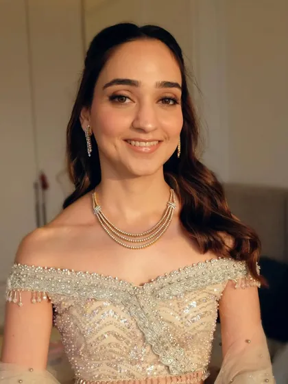 Different angles of this romantic half-up, half-down hairstyle. The soft waves and simple twist at the crown create a look that is both modern and timeless.