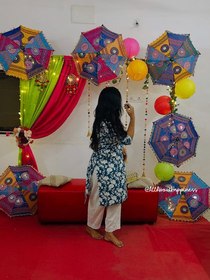 Our founder Gauri adding the final touches to the colorful Mehendi decor, showcasing our hands-on approach.