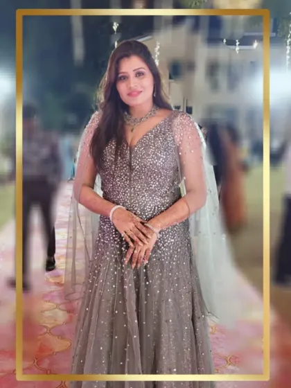 Our client shines in this sparkling grey gown with a cape. This is a perfect choice for a reception, offering glamour and sophistication.