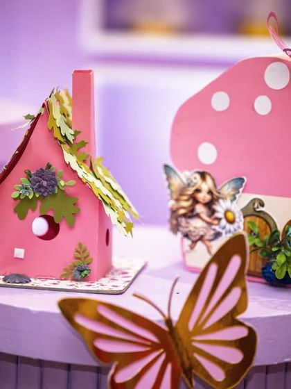 A close-up of the handcrafted details for a fairy party. These tiny mushroom houses and fairy homes were used as decorative accents to bring the enchanted theme to life on every surface.