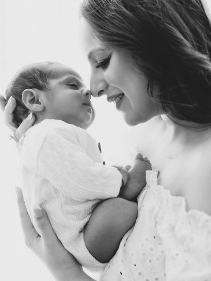 A mother's love in black and white. The nose-to-nose connection between mom and her newborn is a simple, powerful expression of their bond.