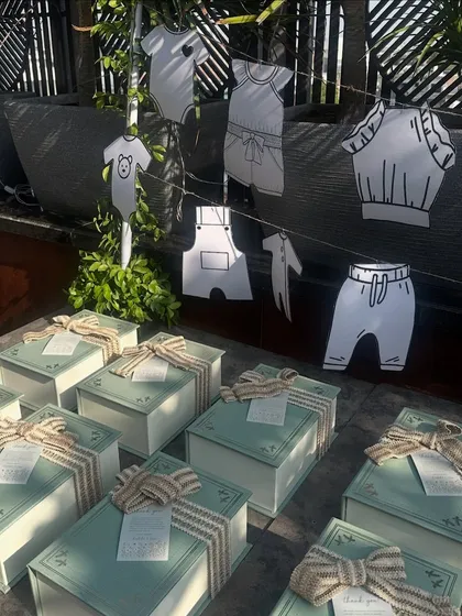 We love creating interactive elements for guests. At this baby shower, we set up a station with beautifully packaged favors and cards for guests to write their wishes for the baby.