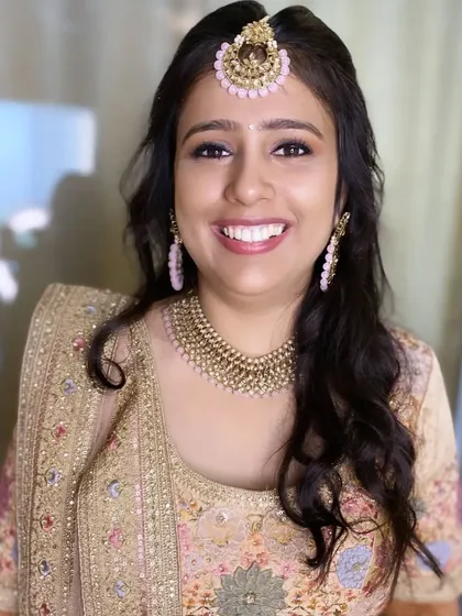 A close-up of this lovely engagement makeup. The focus is on flawless skin and a bright, happy smile.