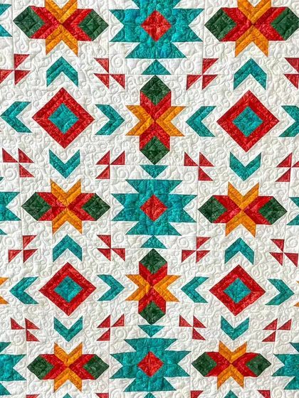 A close-up of the intricate piecing and custom quilting.