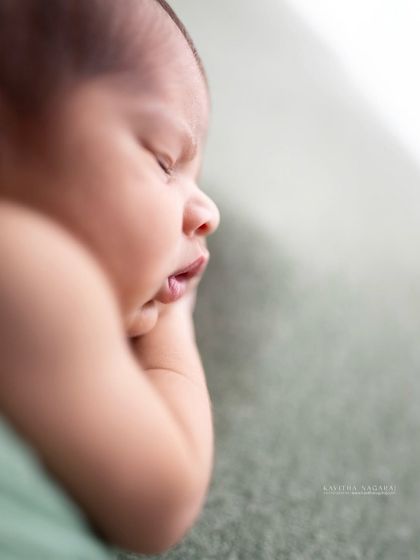 A close-up of a newborn's face in black and white. This style allows you to focus on the emotion and the story within the image, creating a memory you can feel.