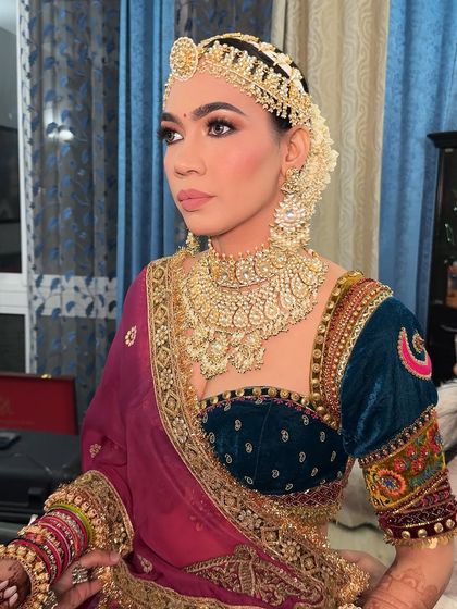 A close-up of the sculpted features and defined eyes. This look is all about creating a strong and confident silhouette.