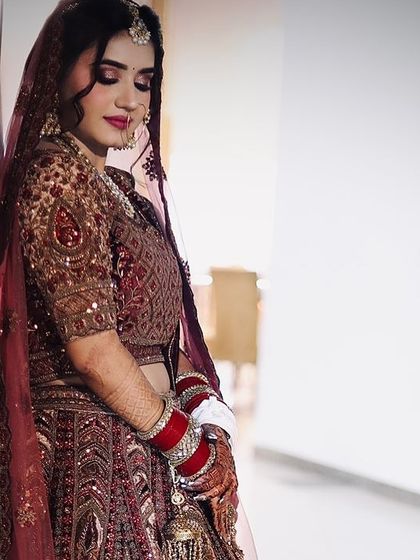 A full-length shot of the bride, looking serene and beautiful. Her makeup lasted perfectly throughout her wedding and reception.