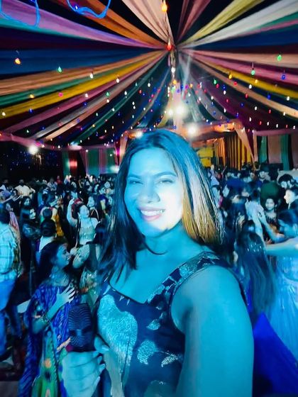 A selfie from the heart of a colorful Dandiya night. The rainbow-colored tent created a magical atmosphere.