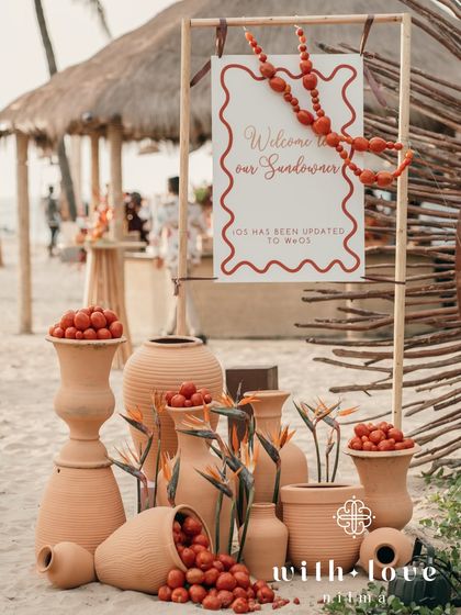 The welcome installation for the sundowner, with terracotta pots and a fun sign that reads "iOS has been updated to WeOS".