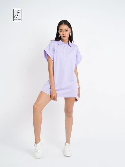 A full-length shot that displays the length of the dress and the model's confident stance.