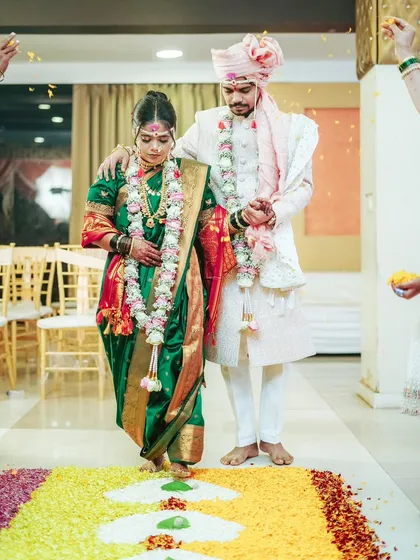 The Saptapadi, or seven steps, is a pivotal moment in a Maharashtrian wedding. I capture this beautiful ritual as the couple takes their first steps into a new life together.