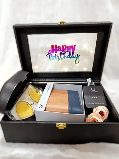 Here’s a classic birthday hamper for him, all set up in a handsome trunk box. It features a stylish wallet, a signature perfume, and a light-up birthday wish to make him smile.