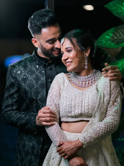 A sweet and intimate moment between the newlyweds at their reception. Their smiles say everything.