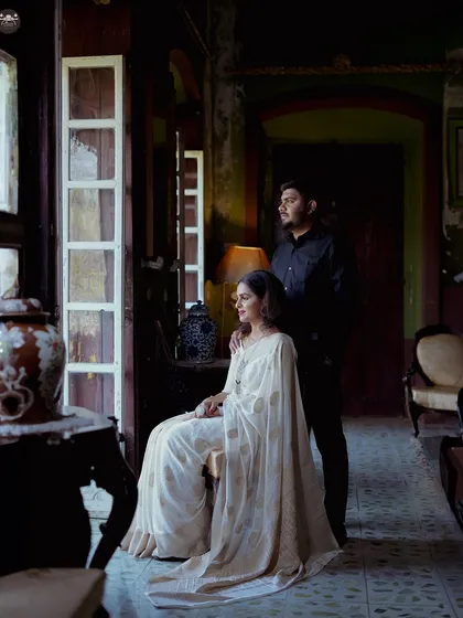 A classic portrait using window light in a heritage home. The composition and lighting give this pre-wedding photo a painterly quality.