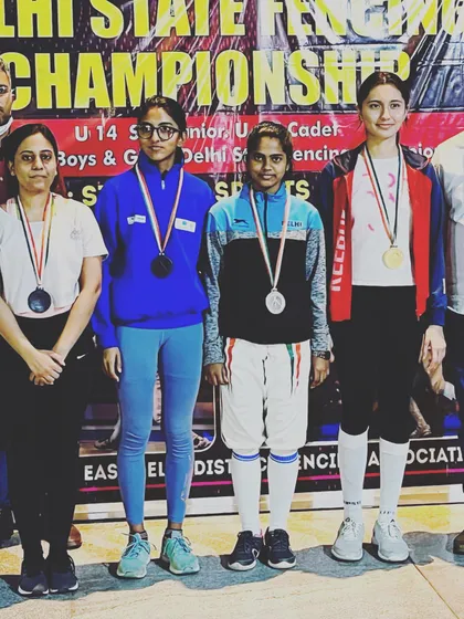 The winners' podium for the senior women's category, with our fencer securing a bronze medal.