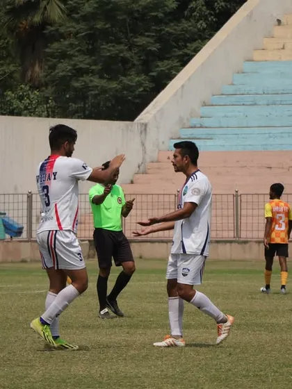 A moment of celebration between two players after a goal in our fourth match.