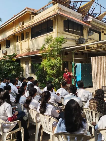 Another perspective of the outdoor lecture for BAMS students, showing the instructor engaging with the group. These sessions bridge the gap between ancient yogic science and modern medical education.