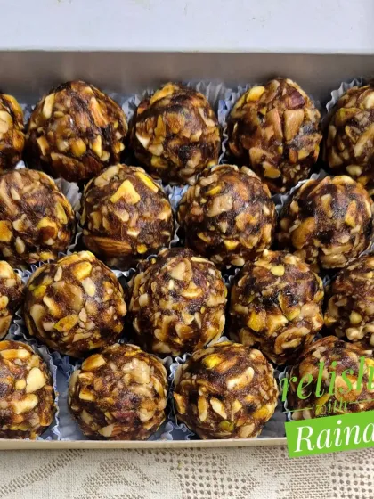 A close-up of the Dryfruit Laddoos, showing the rich texture from the chopped nuts and dates.