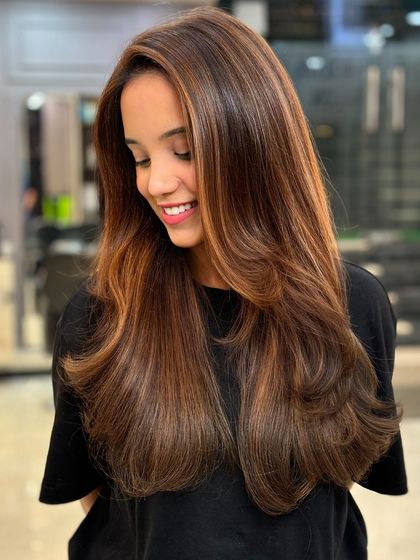 A classic hair color transformation. My artist Rehan created this beautiful look, and the client's happy smile says it all.