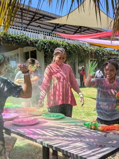 The joy of Holi is universal. Here, our co-farmers enjoy a playful moment with water guns, surrounded by the green expanse of Maamara farm.