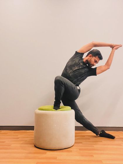 A creative, dance-like movement using a prop for support. Movement exploration is about finding new ways to express yourself through the body.