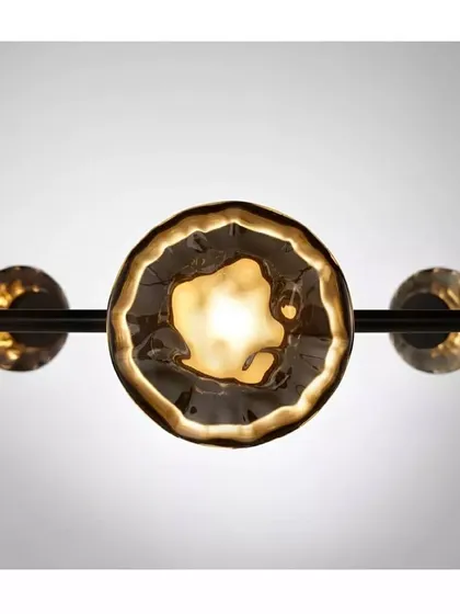 A close-up of a Ceto glass shade, its surface beautifully capturing and refracting the light, reminiscent of the sun on water.