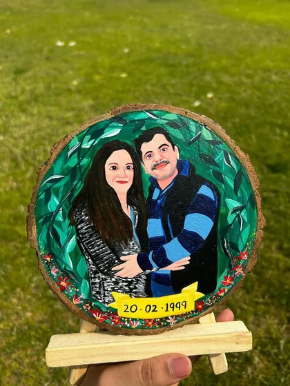 Another angle of the finished anniversary portrait on a wooden easel. The hand-painted date adds a personal touch, making it a cherished memento.