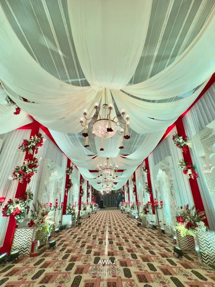 The full view of the red and white walkway, a truly regal entrance for a wedding reception.