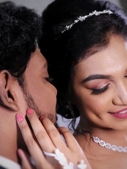 A sweet, candid moment between Jenni and her groom. Her Christian bridal makeup is soft and romantic, with a focus on glowing skin and a pretty pink lip.