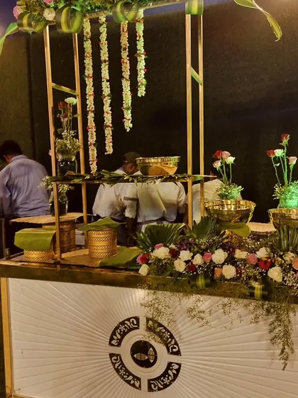My staff preparing a salad counter before an event, ensuring every bowl is fresh and the entire display is perfectly arranged for guest arrival.