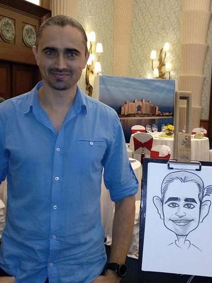 Here I am with my drawing board at a formal event. I can set up my station in any corner to provide entertainment for guests.