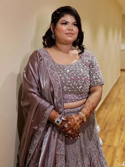 The full view of the stunning party look. The makeup is designed to be elegant and timeless for the special occasion.