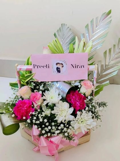 Another angle of the couple's floral basket, showing the hexagonal shape of the basket and the lush, full arrangement of flowers.