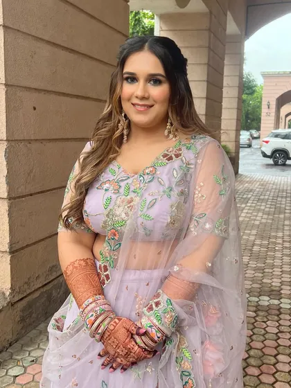 Another angle of this lovely Roka look, showing the intricate details of her outfit and her radiant makeup.