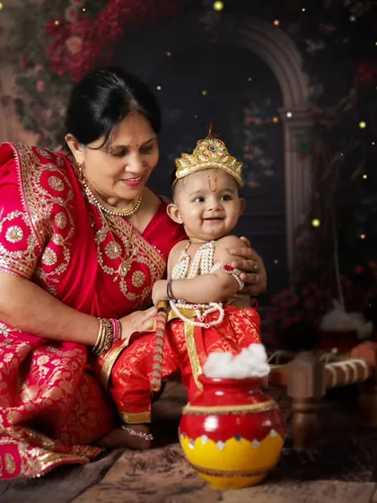 A grandmother's love for her little Kanha. Including grandparents in these festive shoots creates multi-generational memories that the whole family will cherish.