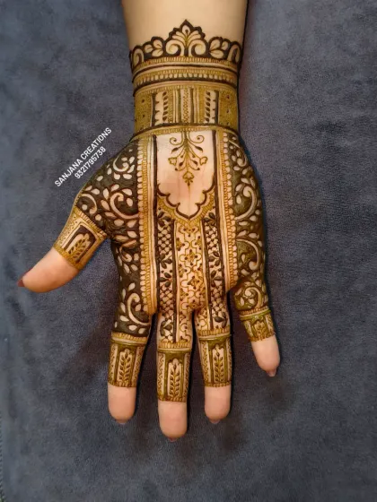 This unique bridal design uses negative space and bold, architectural patterns to create a modern yet traditional look.