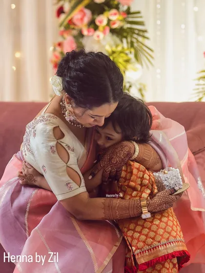 A heartwarming moment between a masi and bhanji, but my eyes are on that fabulous mehendi stain!