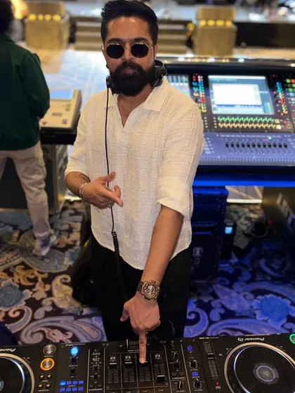 In my element, focused on the mix. This is a close-up look at the DJ booth, where I blend tracks and control the energy of the entire event.